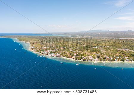Coast Of Cebu Island, Moalboal, Philippines, Top View. Philippine Boats In A Blue Lagoon Over Coral 