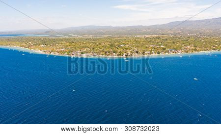 Coast Of Cebu Island, Moalboal, Philippines, Top View. Philippine Boats In A Blue Lagoon Over Coral 