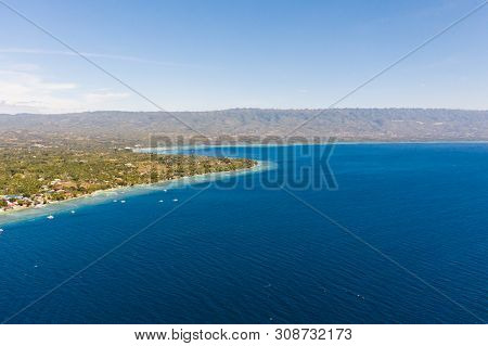 Coast Of Cebu Island, Moalboal, Philippines, Top View. Philippine Boats In A Blue Lagoon Over Coral 