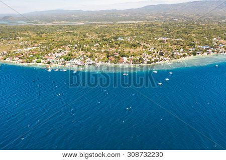 Coast Of Cebu Island, Moalboal, Philippines, Top View. Philippine Boats In A Blue Lagoon Over Coral 