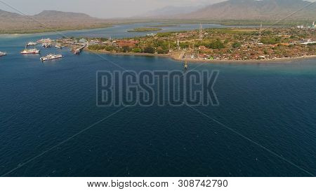 Aerial View Ferry Port Gilimanuk With Ferry Boats, Vehicles. Ferries Transport Vehicles And Passenge