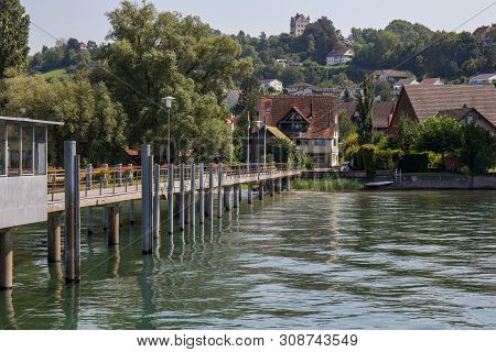Swiss Town Mannenbach On The Rhine With Hithe And Salenstein Castle In The Background