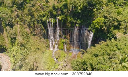Aerial View Waterfall Coban Sewu In Java, Indonesia. Waterfall In Tropical Forest By Drone Tumpak Se