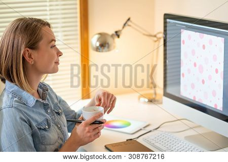 Graphic Designer Works On A Computer Using A Graphic Tablet On A Table. Working With Web Design. Fre