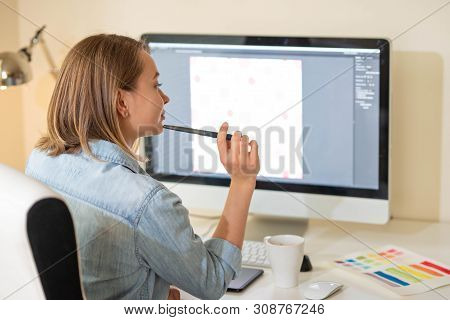 Graphic Designer Sitting At Work. Illustrator. Web Designer. Freelancer