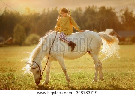 Red Haired Cute Girl With Grey Horse In Pippi Longstocking Style