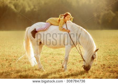 Red Haired Cute Girl With Grey Horse In Pippi Longstocking Style