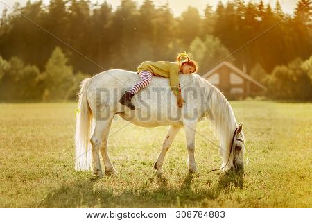 Red Haired Cute Girl With Grey Horse In Pippi Longstocking Style