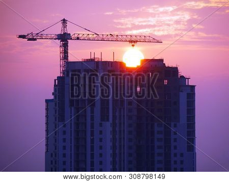 Construction Site Background. Hoisting Cranes And New Multi-storey Buildings. I.ndustrial Background