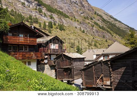 Village With Traditional Wooden Graneries And Houses On The Swiss Alps Mountain, Switzerland