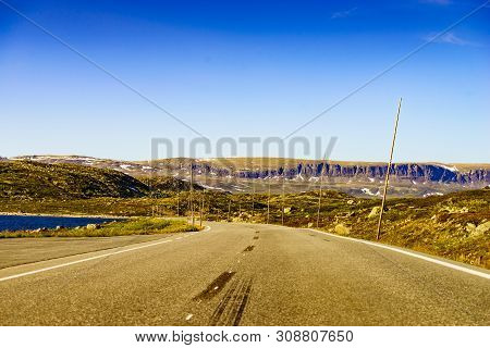 Road Crossing Hardangervidda Plateau, Norway Landscape. National Tourist Hardangervidda Route.