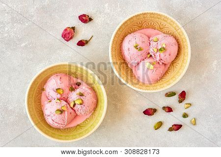 Strawberry Rosewater Ice Cream , Frozen Yogurt With Pistachio And Rosebud. Top View