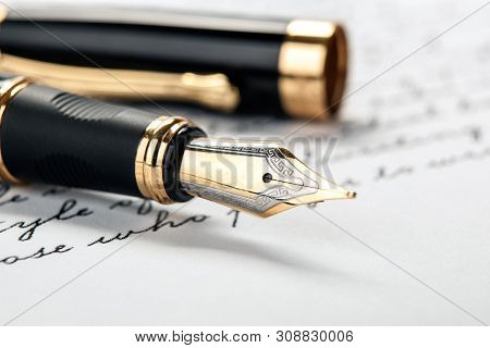 Fountain Pen On Paper With Ink Text Closeup