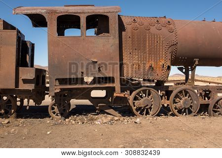 Side View Of A Rusting Steam Train As It Slowly Rots Away At The Train Graveyard Just Outside Of Uyu