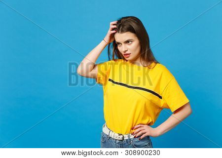 Portrait Of Preoccupied Pensive Young Woman In Vivid Casual Clothes Looking Aside, Putting Hand On H