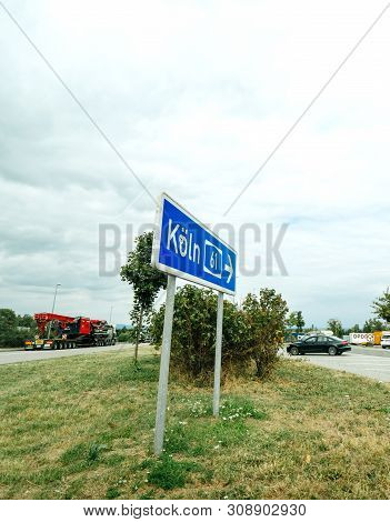 Koln, Germany - Aug 15, 2018: Autobahn Street Wign In Parking With Koln 61 And Arrow On The Blue Sig