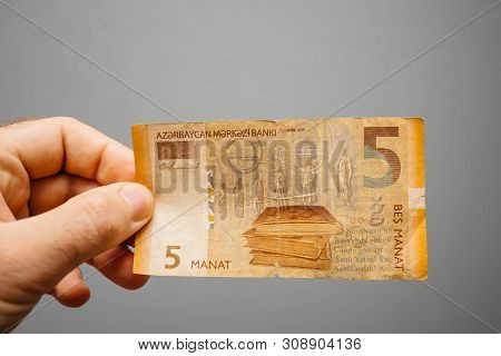 Paris, France - May 19, 2019: Man Hand Holding Against Gray Background 5 Azerbaijani Manat Pepr Curr