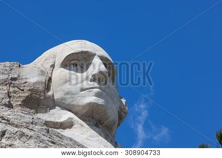 Looking Up At A Carved Likeness Of George Washington, One Of Four United States Presidents Carved In