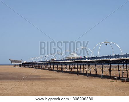 Southport, Merseyside, United Kingdom - 28 June 2019: People On The Historic Pier In Southport Merse