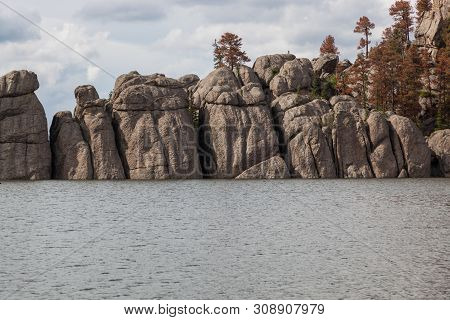 Large Granite Rock Formations Rise Out Of The Water And Create A Natural Barrier For The Waters Of S