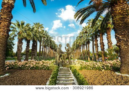 Two Black Men Statue Standing And Talking To Each Other In Public Park Called Kültürpark At Izmir, T