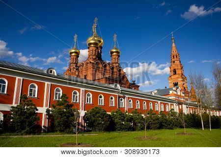 Sergiev Posad, Russia, May 2017. Chernihiv Skit. A Red Brick Hermitage With Golden Domes Against A B