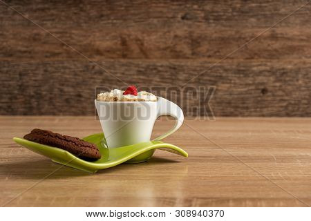 Whipcreamed Sspresso With A Raspbeery And Chocolate Scone Ready To Be Served