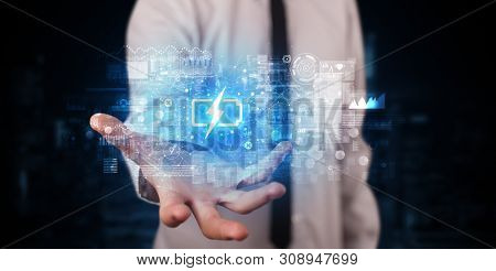 Elegant hand holding battery with full of energy