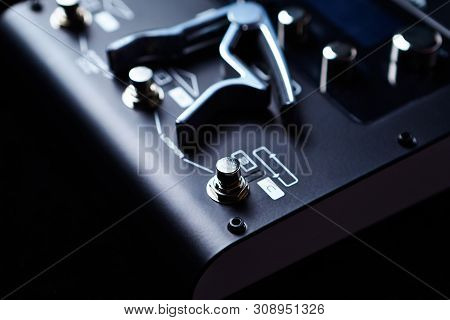 Multieffects Processor For Electric Guitar On Black Background.