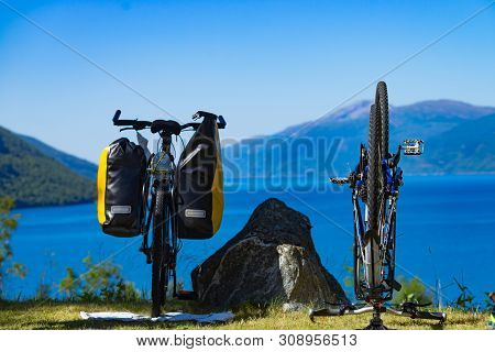 Bike Repair. Mountain Bicycle With Saddlebag Against Nature, Mountains Fjord Landscape In Norway