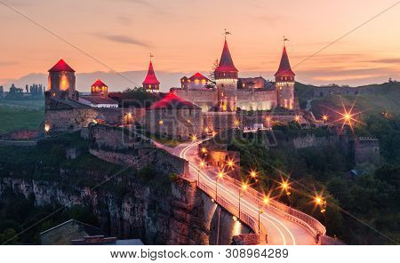 Old Medieval Fortress In Kamenets Podolsky Town The Late Evening. Ancient Beautiful View Of Medieval