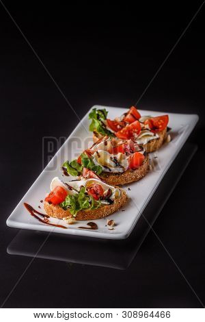 Bruschetta With Tomatoes, Lettuce, Camambert, Balsamic Vinegar