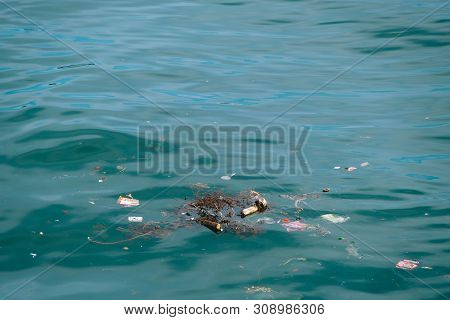 Trash, Plastic, Garbage, Bottle... Environmental Pollution On The Beach. Royalty High-quality Free S