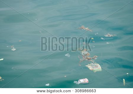 Trash, Plastic, Garbage, Bottle... Environmental Pollution On The Beach. Royalty High-quality Free S