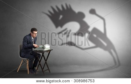 Man working hard and he is afraid of a yelling shadow