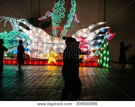 Shantou/china-30 March 2018:silhouette Of Unacquainted Chinese People Danceing In Jinshan Park Of Sh
