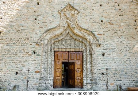 Arnad,italy/aosta Valley-june 4,2019.the Stone Church Of Saint Martin Of The 1500s With A Tuff Arch 