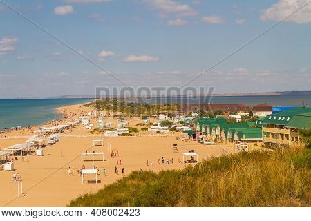 View Of The Beach On The Bugaz Spit In Anapa In Russia. The Beach Is Surrounded By The Sea On Both S