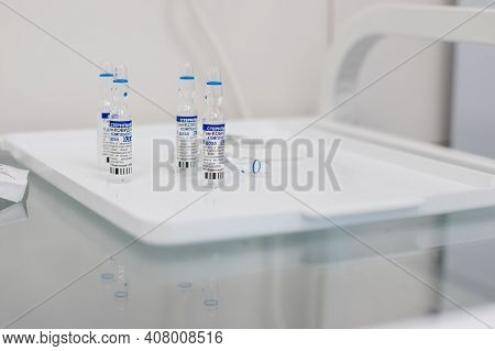 Omsk, Russia, February 9, 2021.sputnik Vaccine. Vaccine Ampules Known As Sputnik V.ampules With Russ
