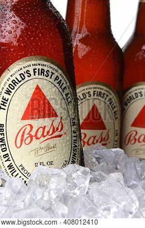 IRVINE, CA - MAY 30, 2014: Closeup 0f Bass Pale Ale bottles in ice. The Bass Brewery was founded in 1777 by William Bass, in Trent, England is now owned by Anheuser-Busch InBev.