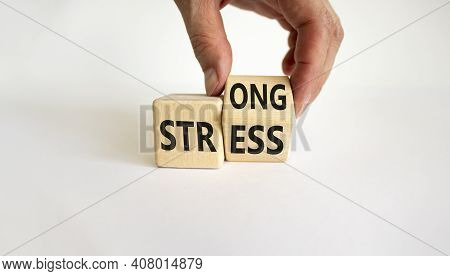Strong Stress Symbol. Businessman Turns Wooden Cubes With Words 'strong Stress'. Beautiful White Bac