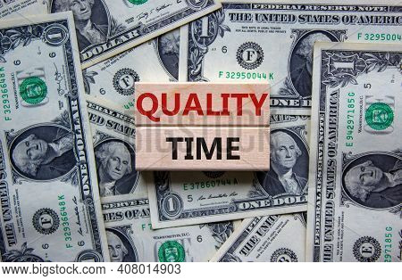 Quality Time Symbol. Wooden Blocks With Words 'quality Time'. Beautiful Background From Dollar Bills