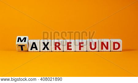 Max Tax Refund Symbol. Turned Wooden Cubes With Words 'max Tax Refund'. Beautiful Orange Background,