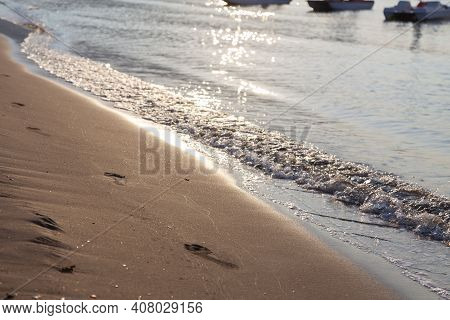 In The Background, Sea Waves Run Ashore