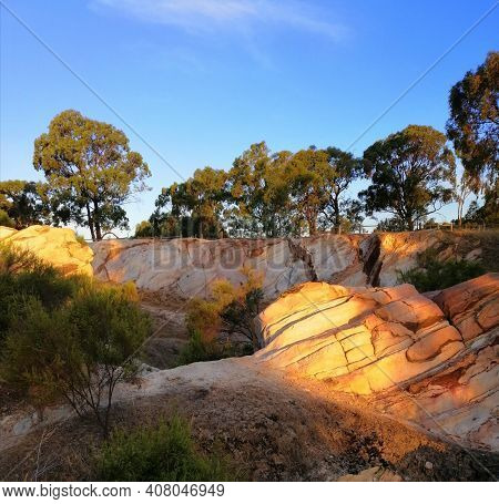 The Afternoon Sun Shining On Rocks At The Old Gold Diggings At Bendigo Victoria Australia.