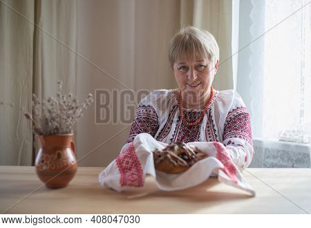 Homemade Cherry Pie In Hands Of Woman Wearing Traditional Ukrainian Costume