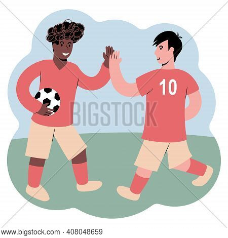 Two Young Male Soccer Players Highfiving. Football Players Cheering Each Other.