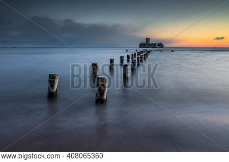 Gdynia, Poland - 06 February 2021: Winter Landscape At The Sea. Frozen Wooden Breakwaters Line To Th
