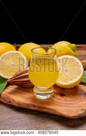 Ice Cold Sweet Limoncello Liqueur Made From New Harvest Of Fresh Ripe Yellow Italian Lemons, Amalfi
