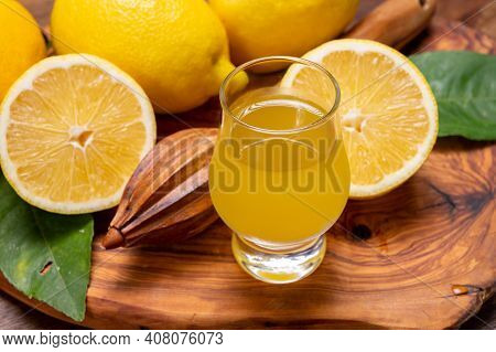 Ice Cold Sweet Limoncello Liqueur Made From New Harvest Of Fresh Ripe Yellow Italian Lemons, Amalfi